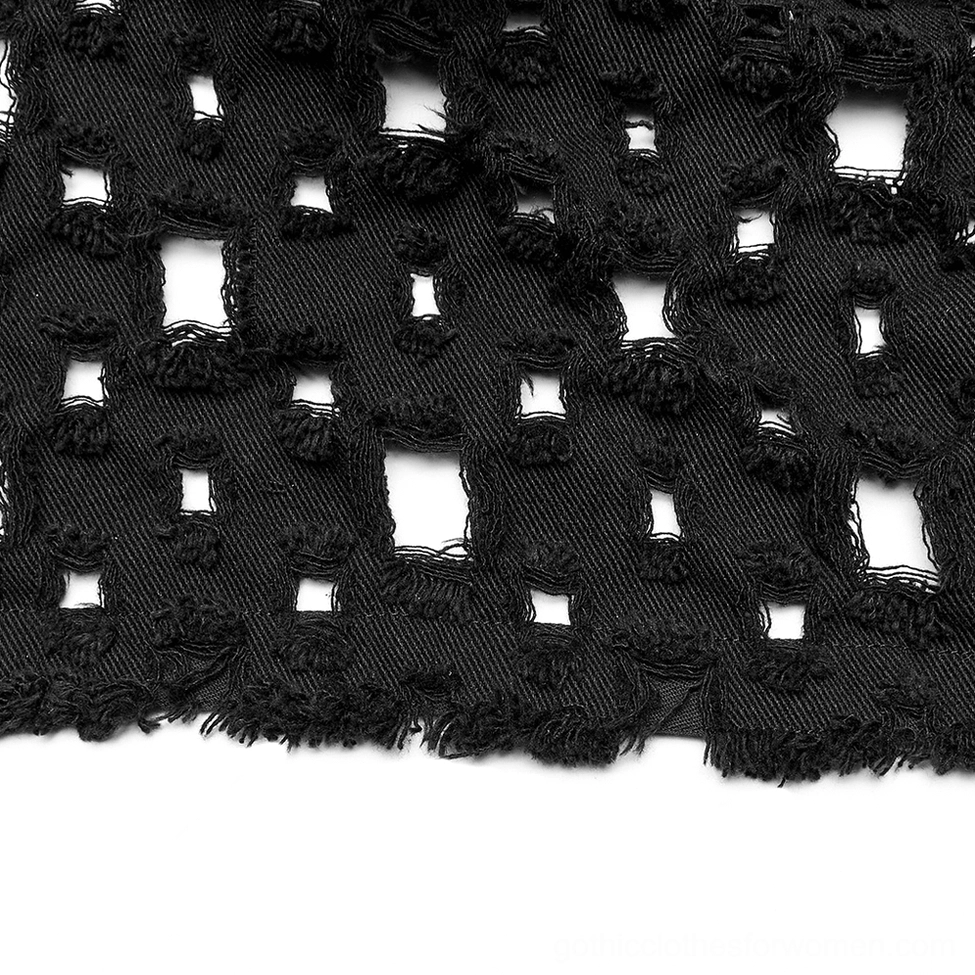 Flat lay fabric close-up of black distressed twill showing square cutouts with frayed raw edges on cape cardigan