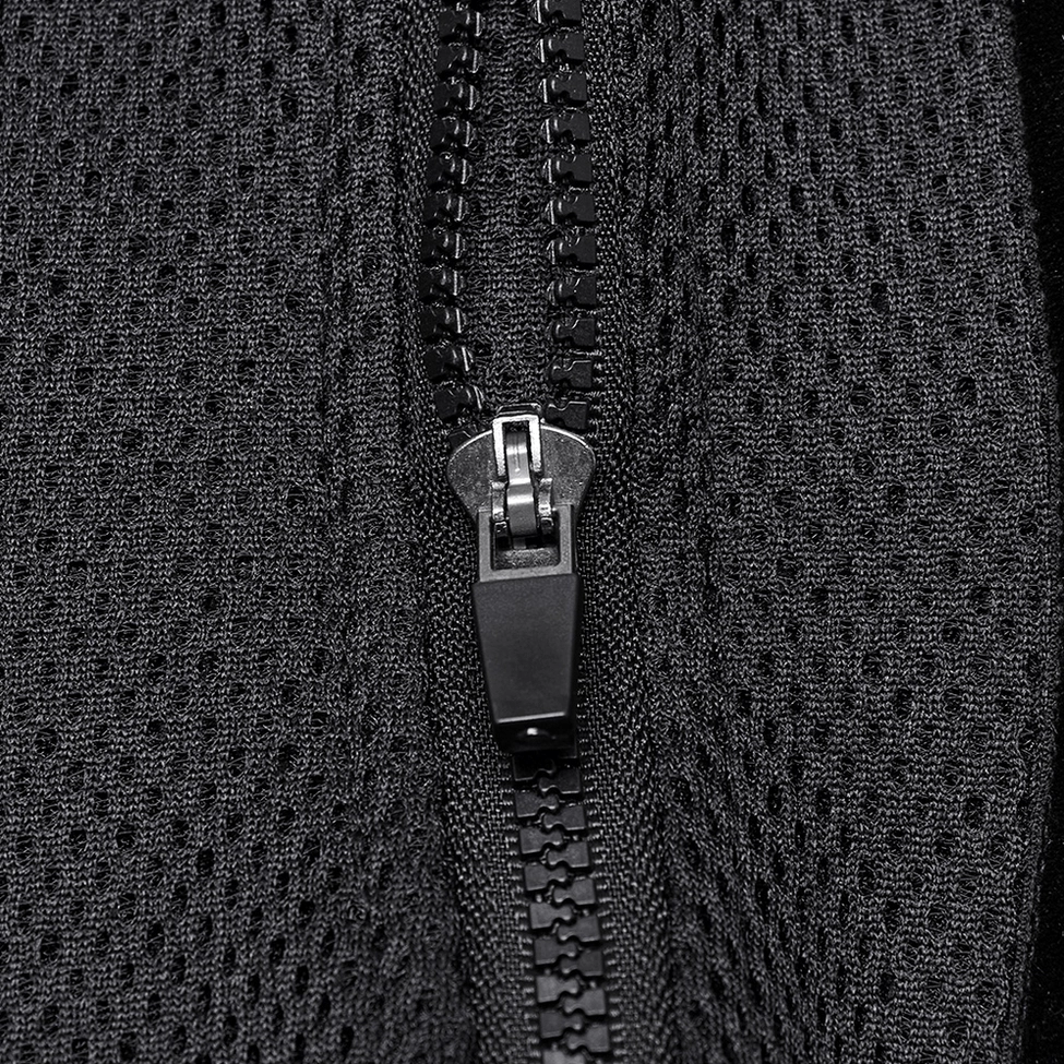 Macro close-up shot of black corset cyber-themed embossed pattern and velvet trim texture details