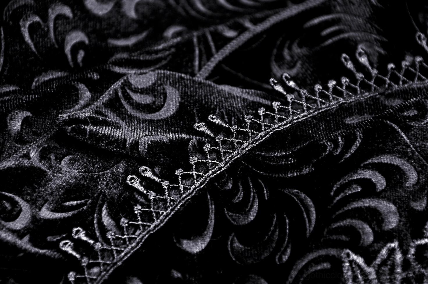 Black velvet fishtail skirt design with baroque lace embroidery and satin ribbon accents throughout