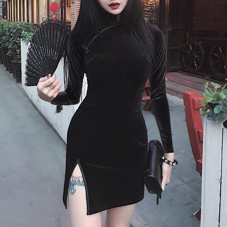Black velvet cheongsam dress model front view with decorative fan accessory