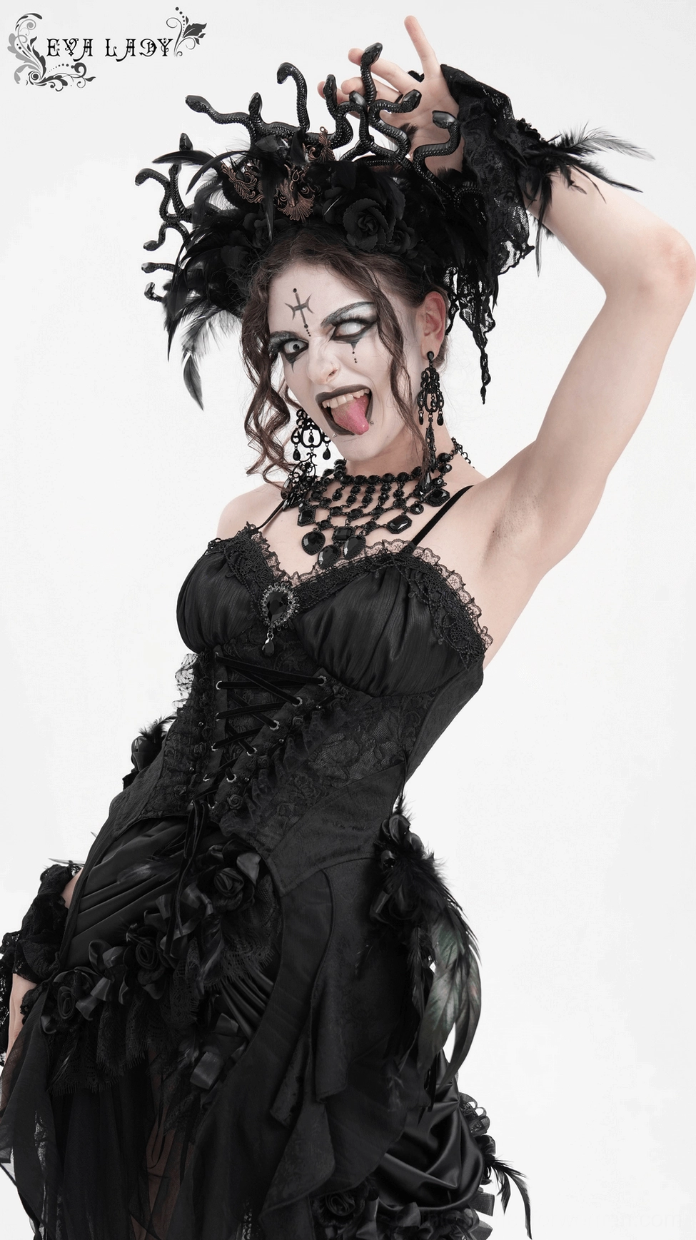 Black corset top showcasing velvet rose patterns and lace-up closure with metal hardware