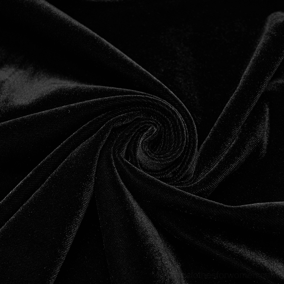 Detailed close-up of soft plush black velvet fabric texture showing luxurious drape and richness of material
