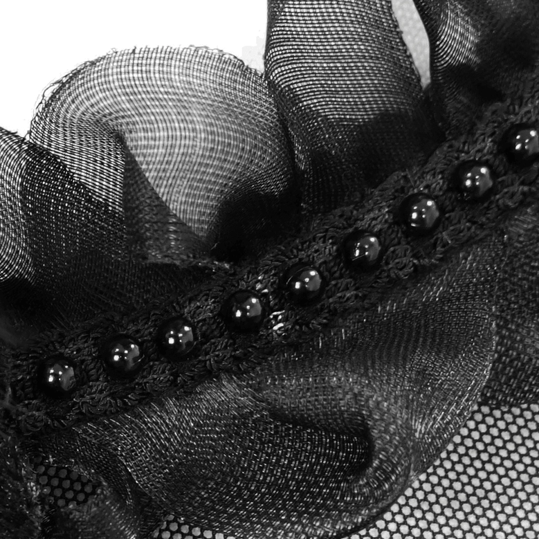 Black velvet fabric texture and quality close-up showing soft nap and drape of premium velvet