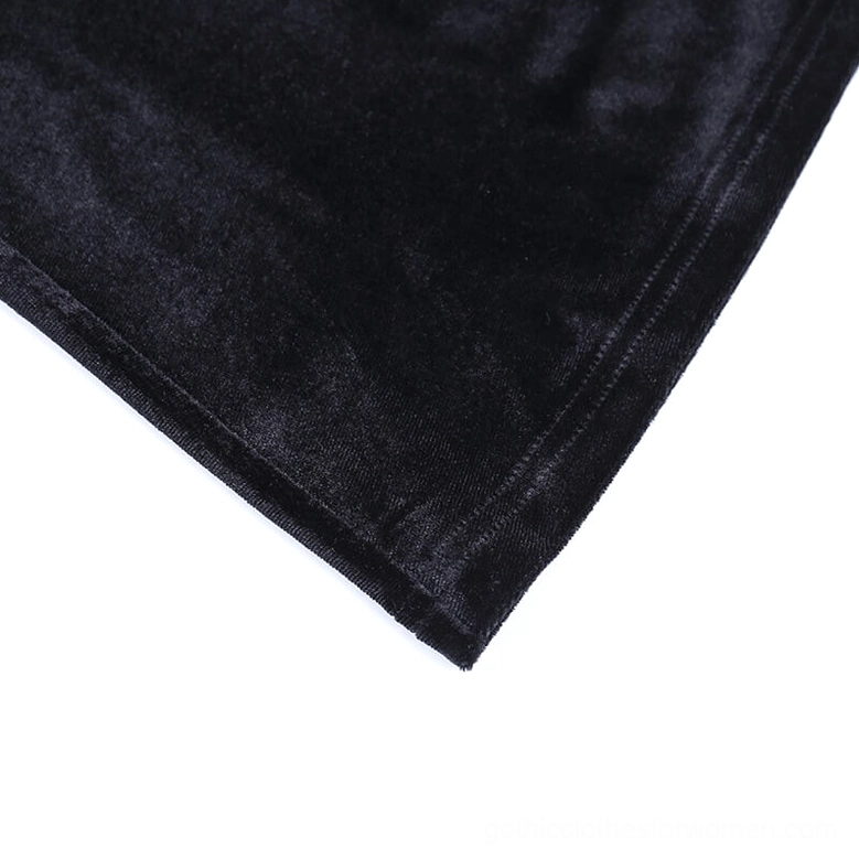 Black velvet flare pants with mesh thigh inserts and studded gothic details, alternative fashion styling perspective