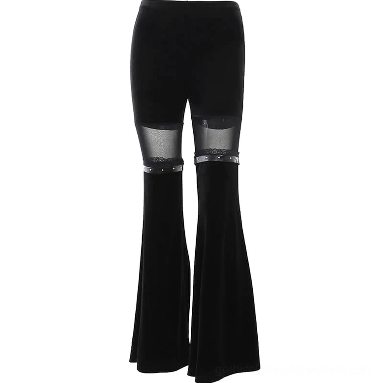 Flat lay front view of black velvet gothic flare trousers with mesh panels and studded leather details