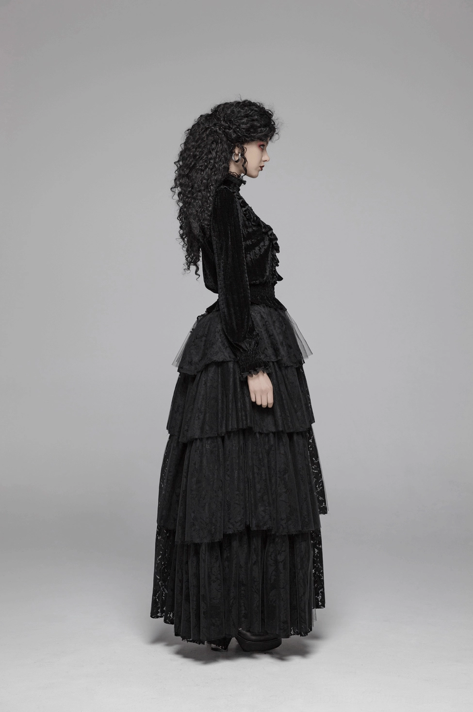 Black velvet Gothic blouse showing lace and embellishment details including collar ruffles, trim work, and decorative elements