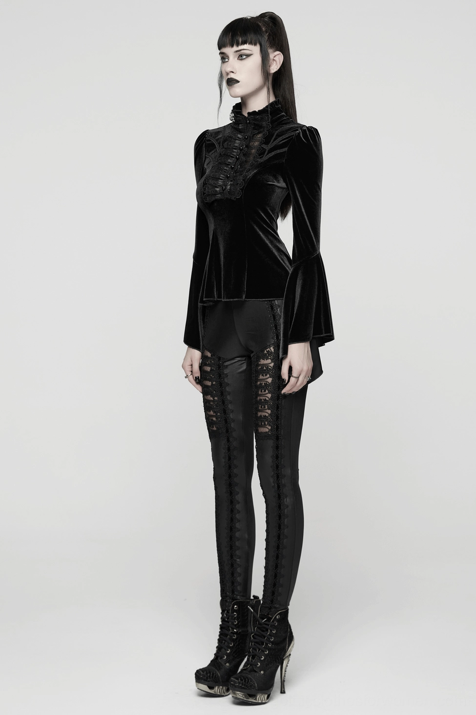 Black velvet gothic blouse model wearing showing how ruffled high collar frames face and bell sleeves drape naturally on body