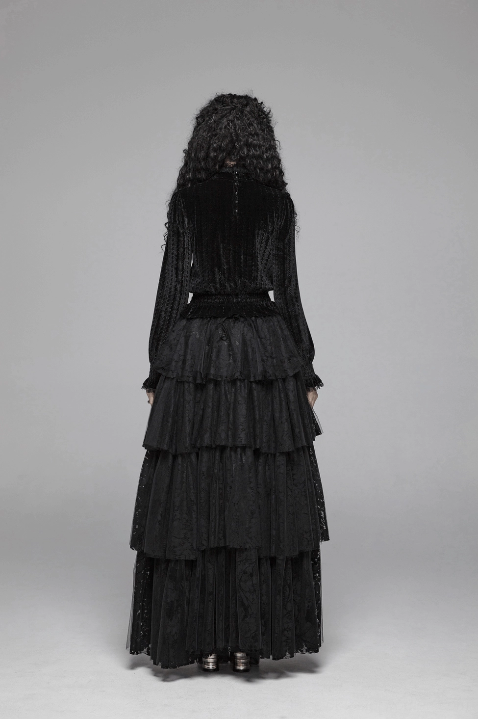 Black velvet Gothic blouse styled view highlighting how the dramatic ruffle collar frames the neckline and the fitted silhouette overall aesthetic