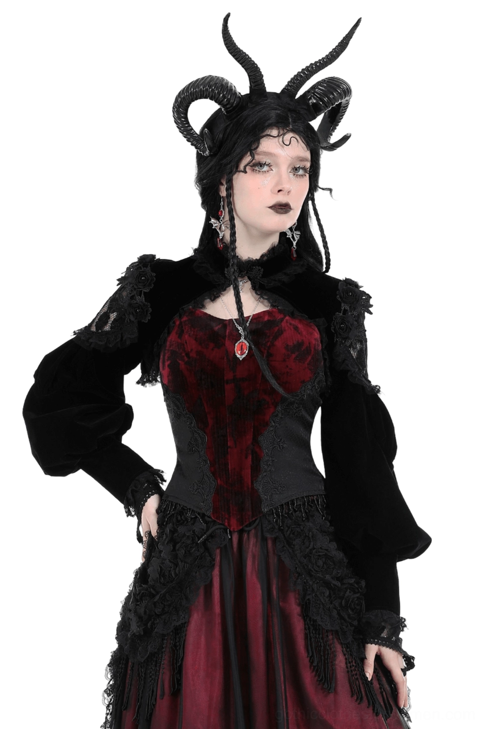 Black velvet gothic bolero with lace trim worn on model with horn headdress, front full view with puff sleeves and structured silhouette
