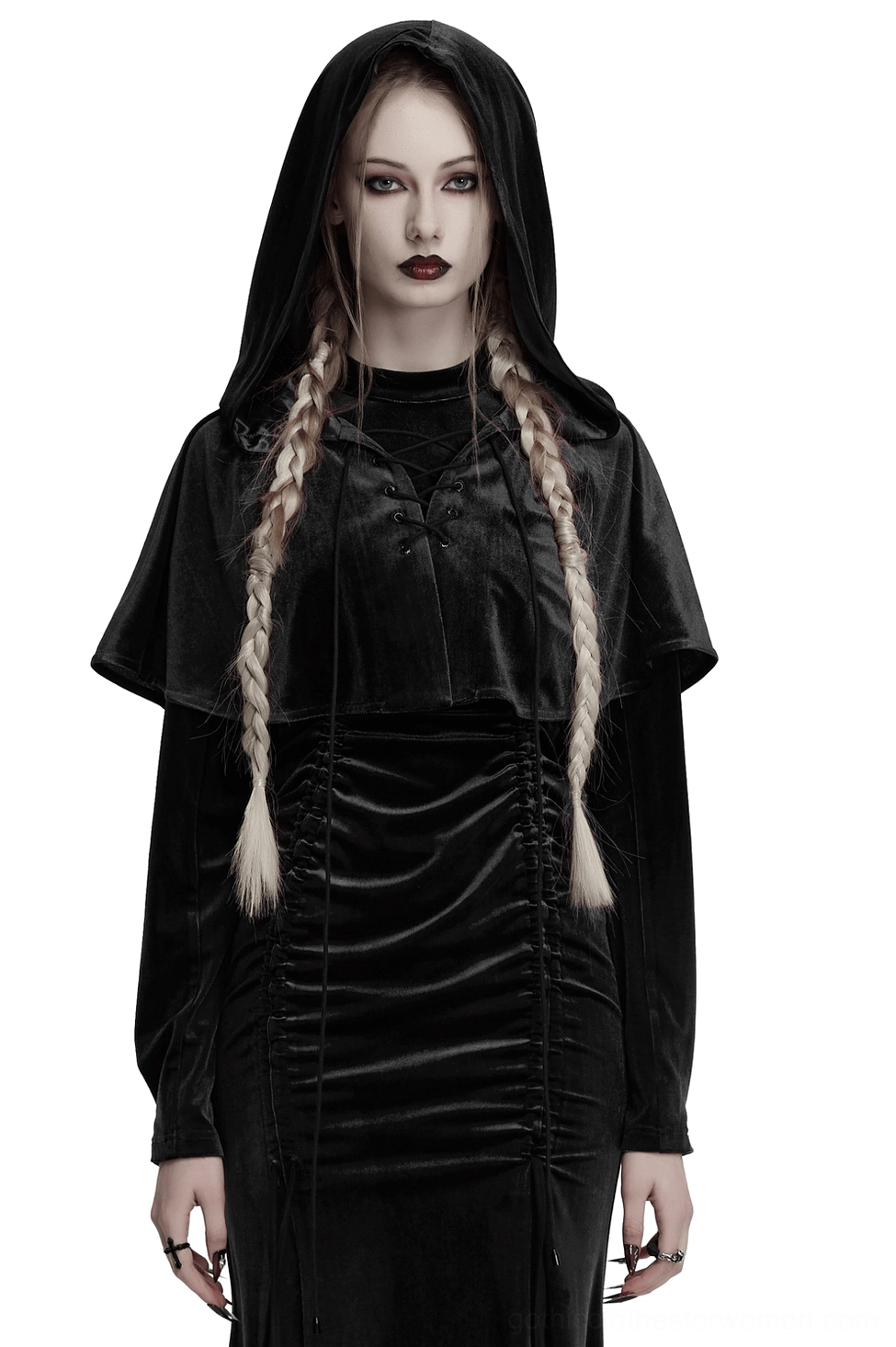 Black velvet hooded gothic cape with lace-up front worn by female model with braided hair, front three-quarter view showing dramatic drape and metal eyelet details
