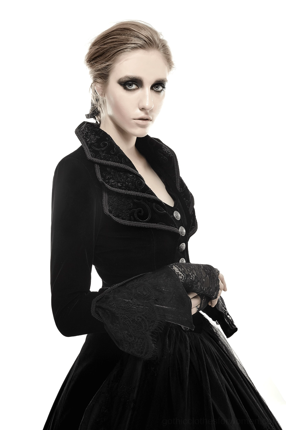 Black gothic velvet coat styling shot showing complete ensemble with cascading collar and wave back design