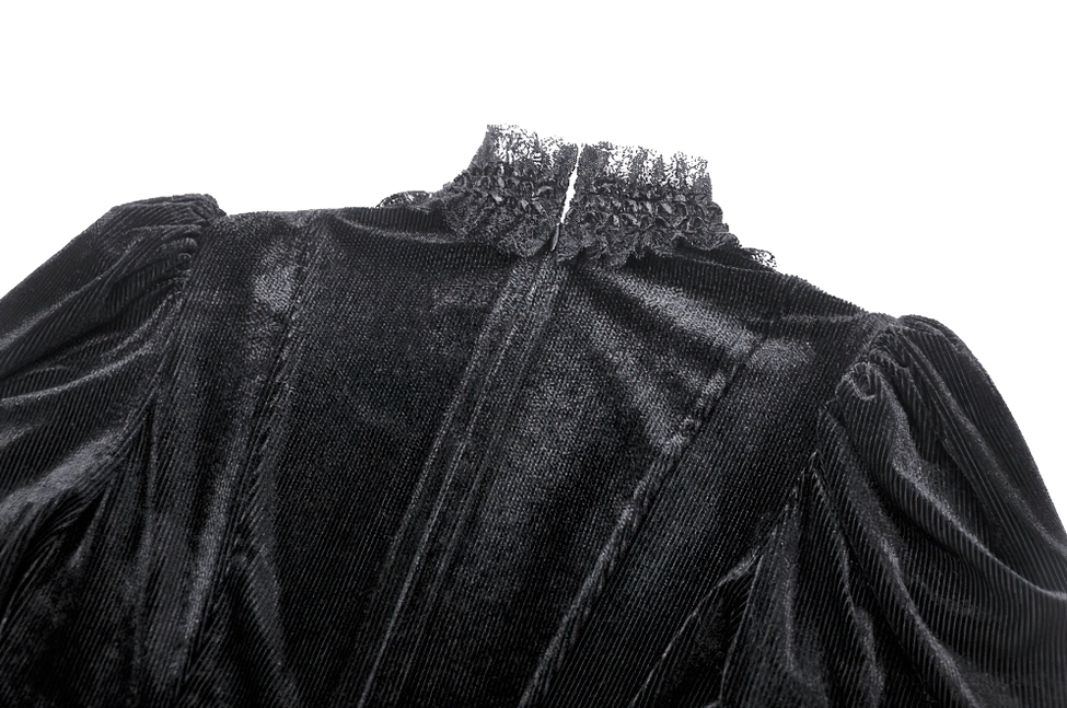 Black velvet gothic mini dress with lace ruffles, puff sleeves, and sheer bust panel styled as alternative fashion statement piece