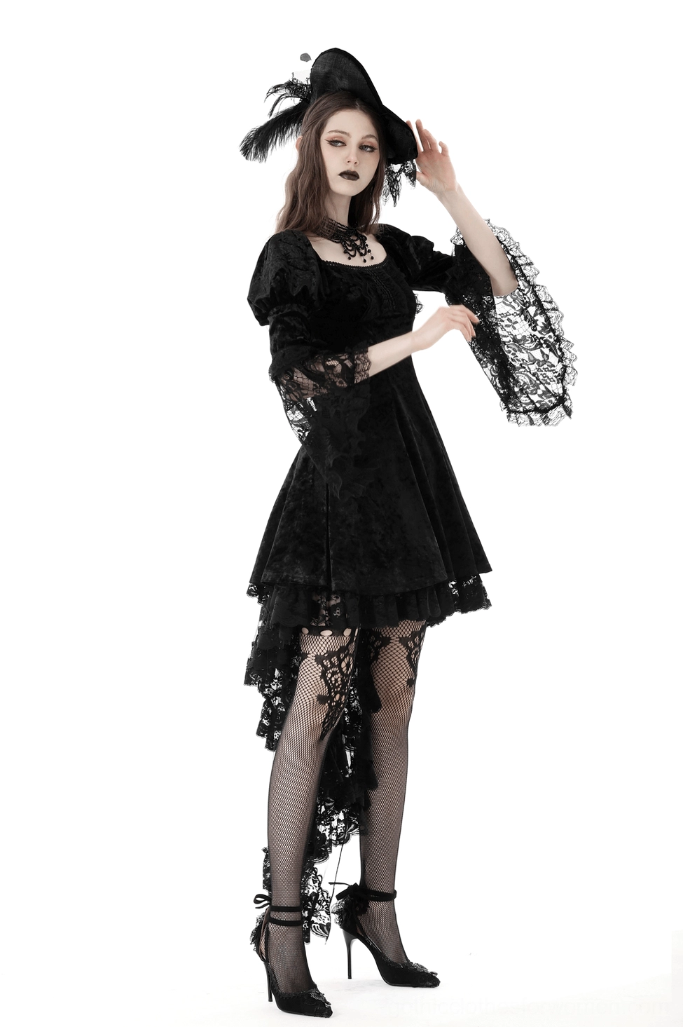 Black velvet gothic dress detail shot - asymmetrical hem and layered tulle design