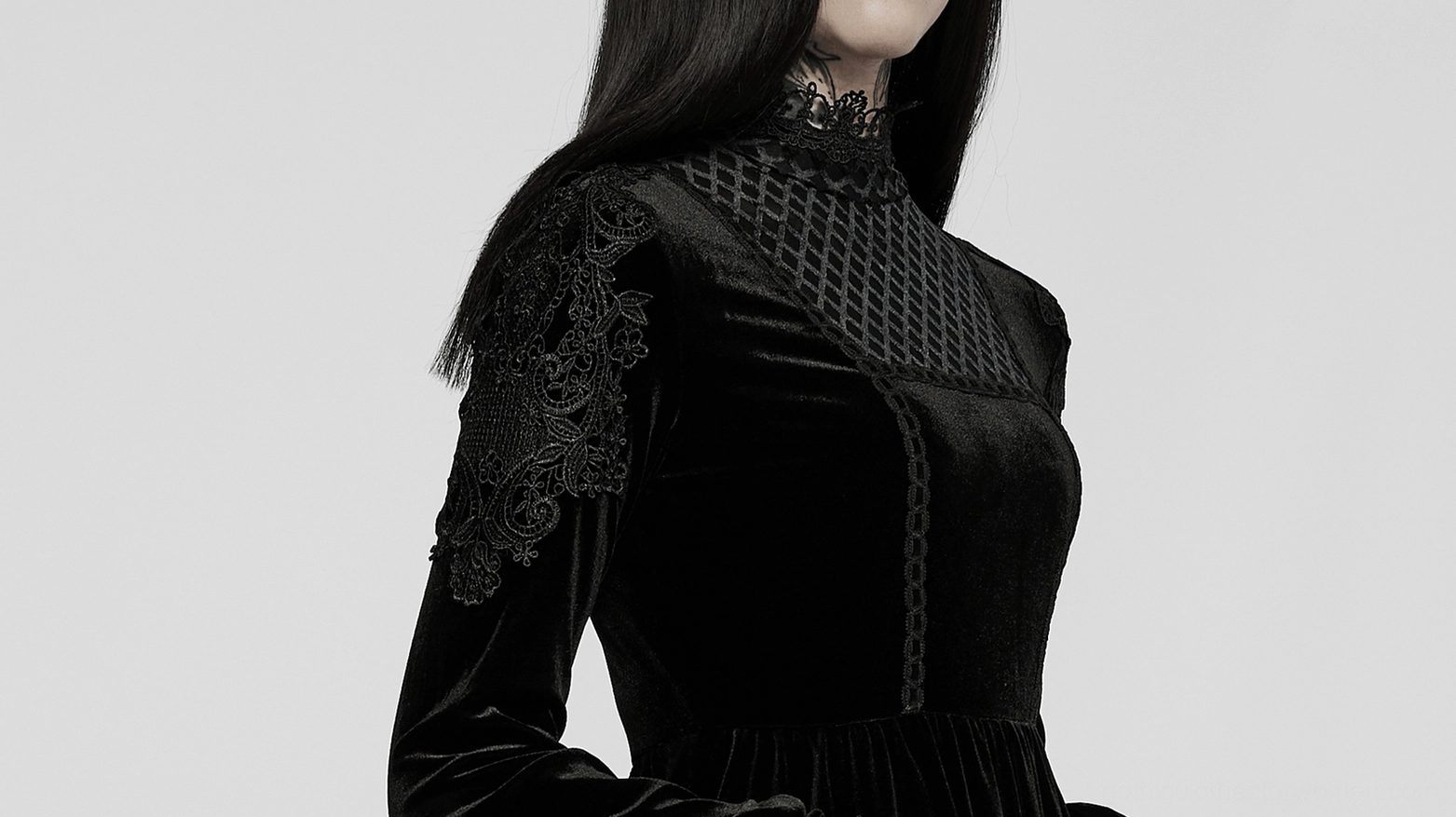 Detailed view of black velvet gothic dress construction showing premium fabric quality and lace accents