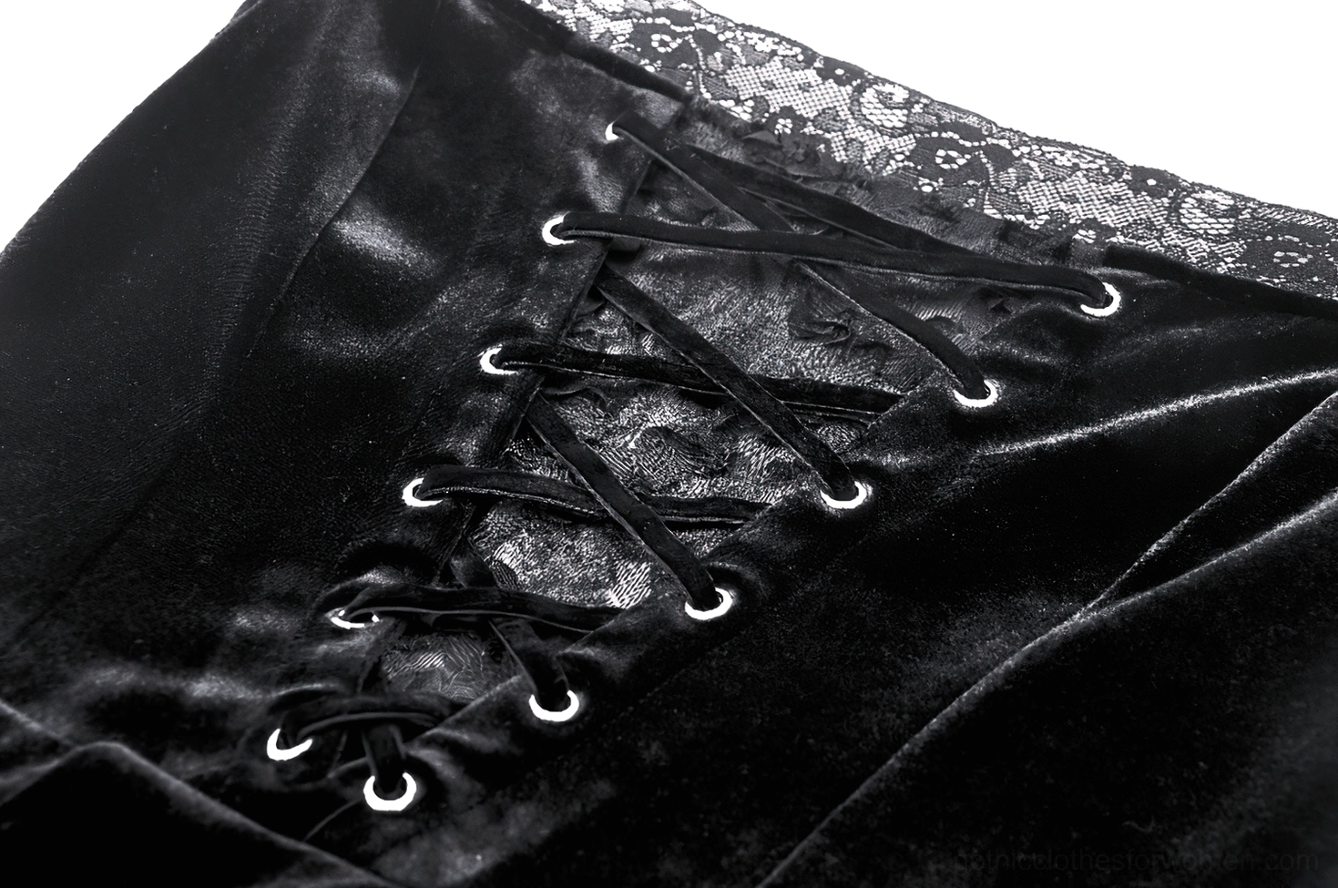 Close-up detail of gothic dress front corset lacing showing black velvet fabric, delicate lace trim edges, and metal eyelet construction for authentic corsetry effect