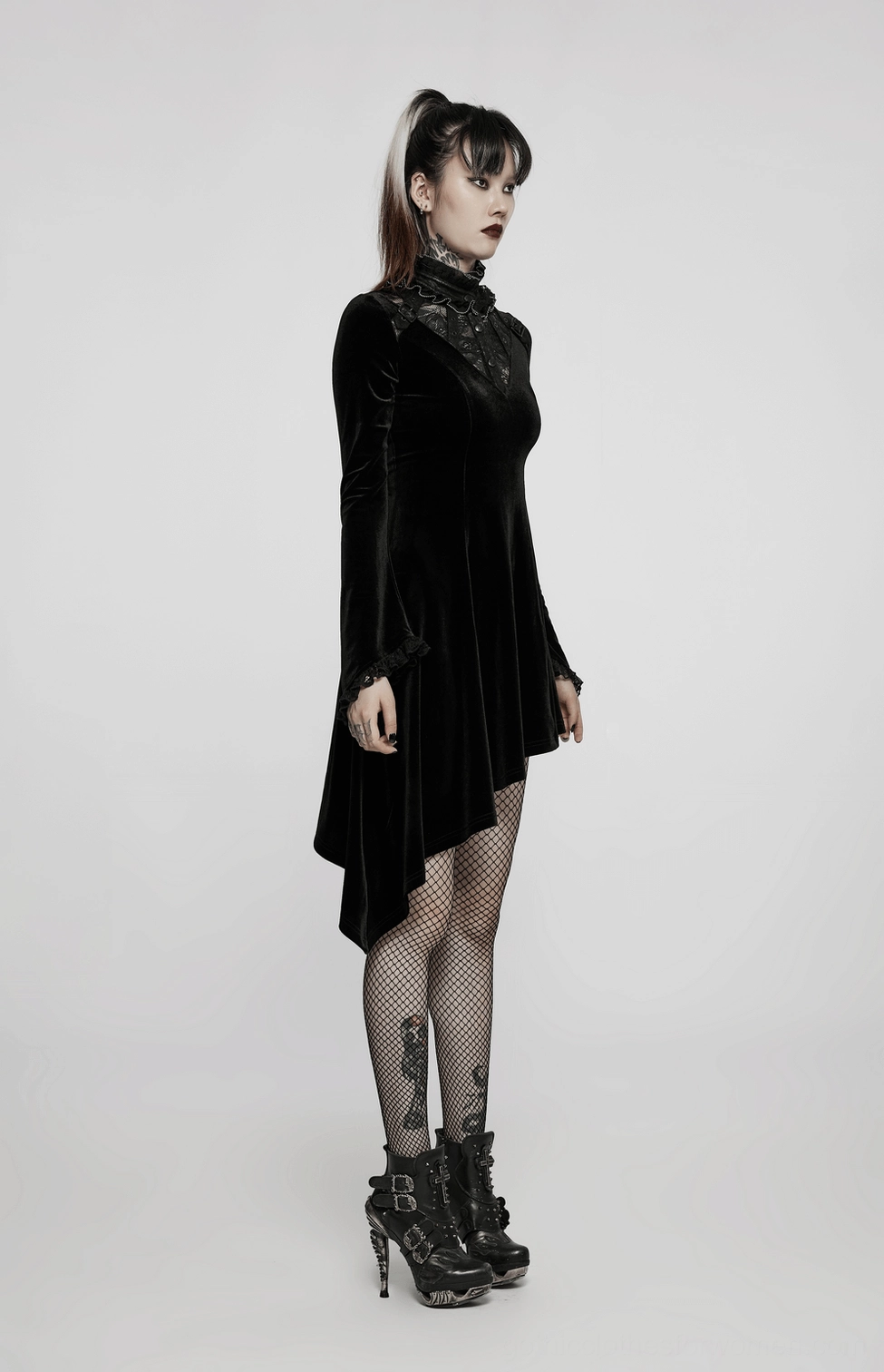 Black velvet gothic asymmetrical dress featuring lace corset back, ruffled collar, and flared sleeves