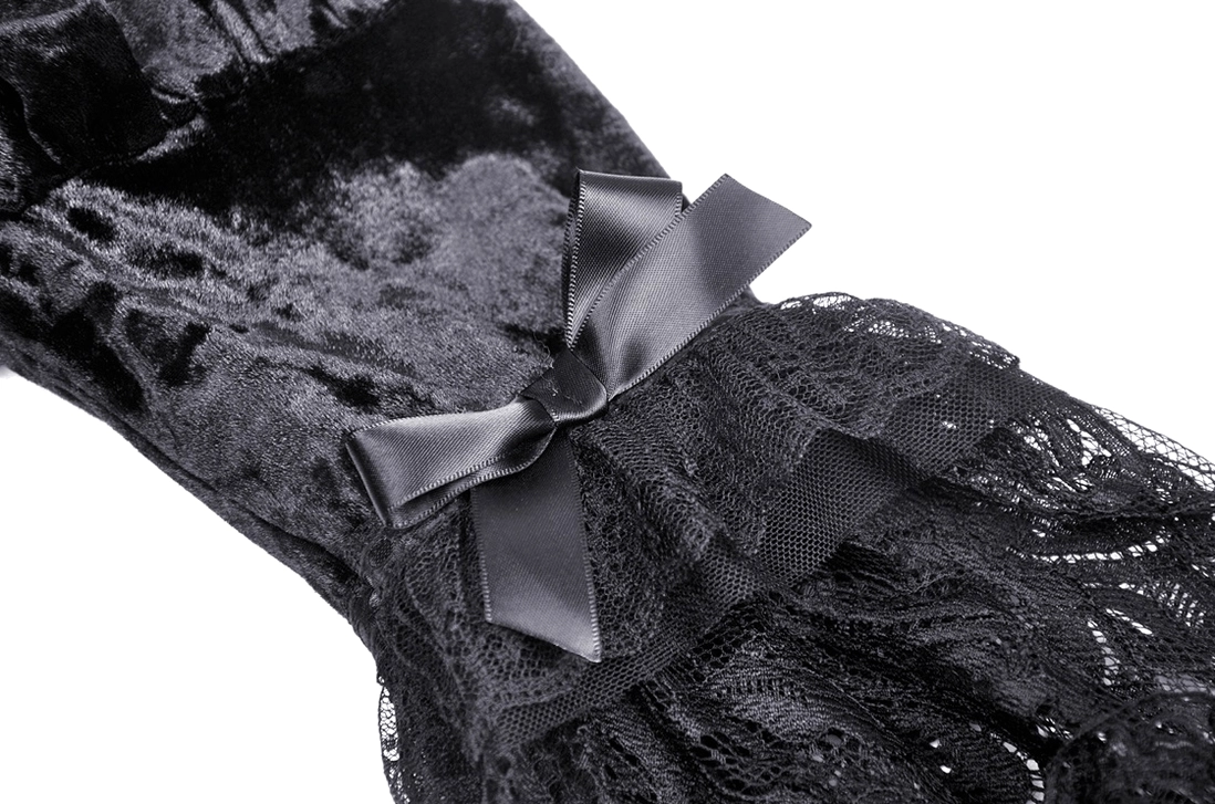 Black velvet lace bell sleeve close-up with satin ribbon bow detail