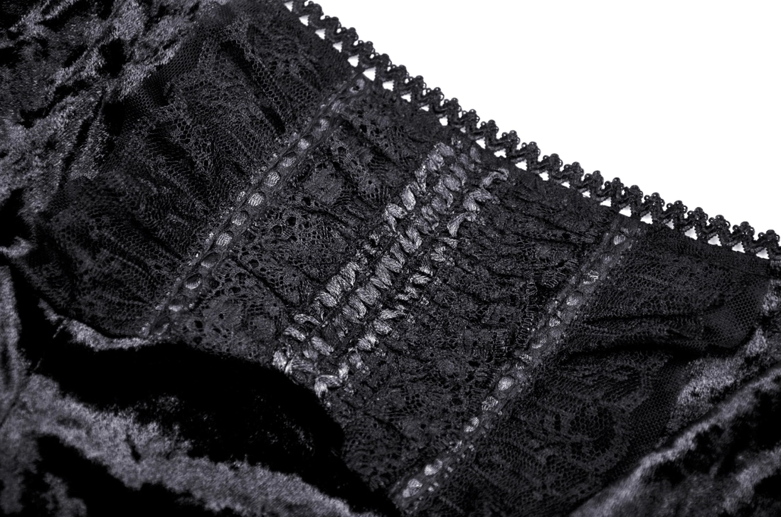 Textured lace panel detail on black velvet gothic dress showing sheer and scalloped edge