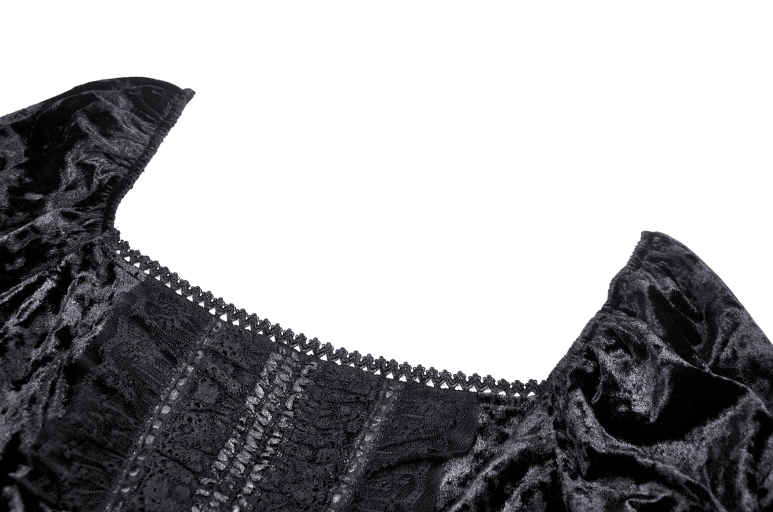 Close-up detail of black velvet neckline with embroidered lace trim and scalloped edges