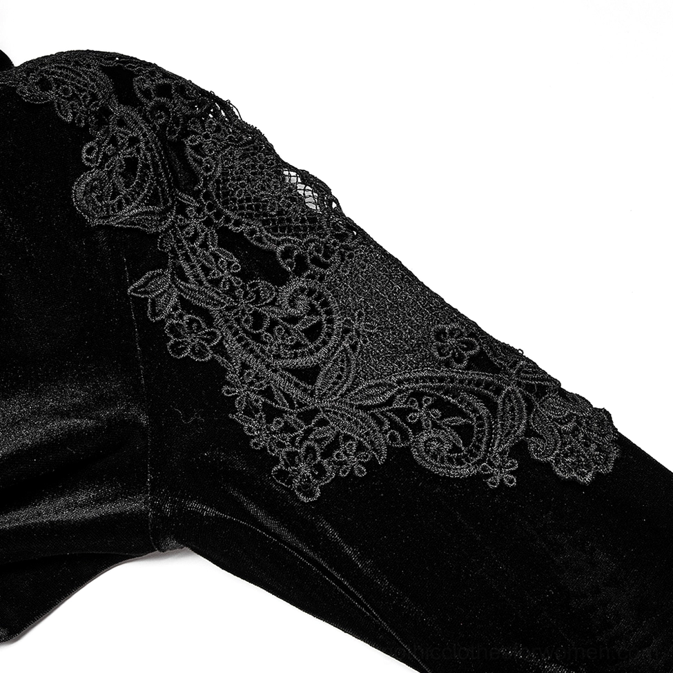 Shoulder detail close-up of black velvet gothic dress showing floral embroidered lace appliqué