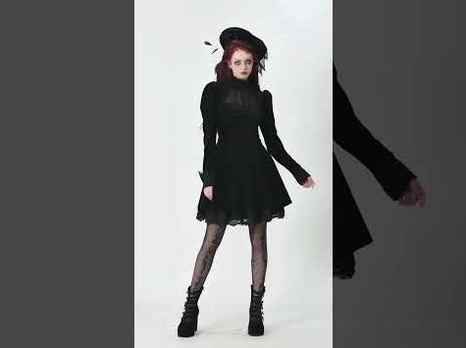 Side profile view of black velvet gothic mini dress showcasing fitted waist, flared skirt, and voluminous puff sleeves on model