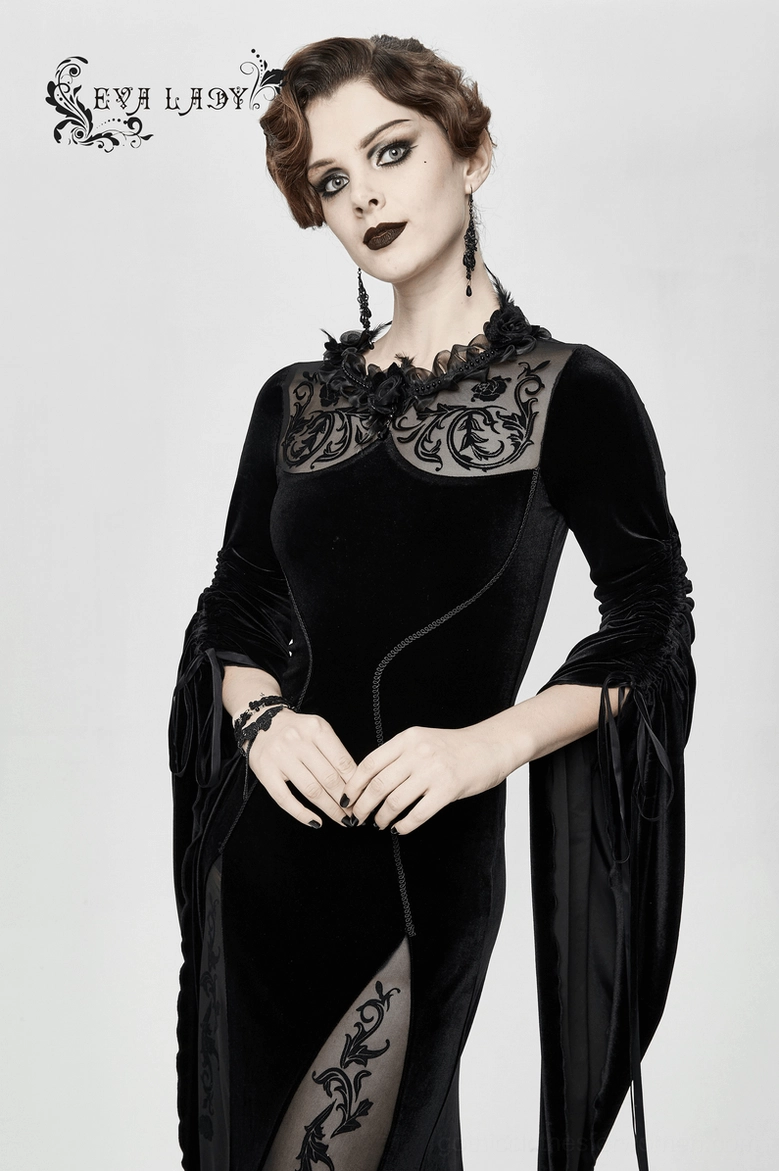 Complete side profile view of black velvet gothic midi dress on model showing silhouette