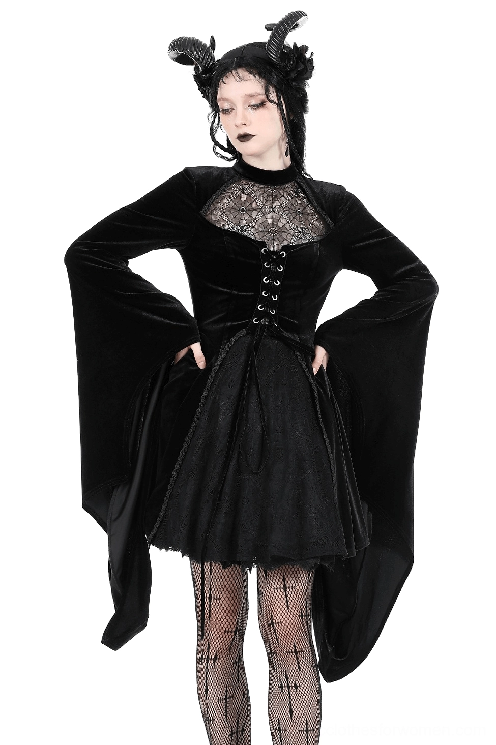 Black velvet lace-up gothic dress front three-quarter view with spiderweb lace bust panel and dramatic bell sleeves worn on model