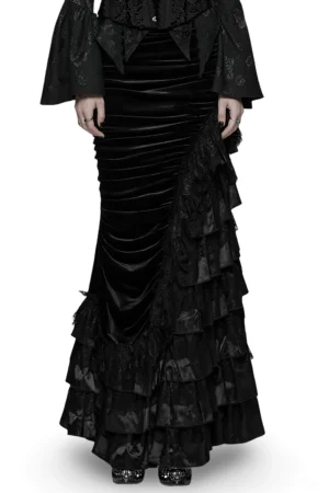 Model wearing black velvet gothic fishtail skirt with tiered lace ruffles - full front view showing high waist and layered hemline
