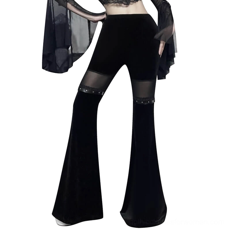 Black velvet flare pants with mesh thigh inserts and studded trims, front view on model showcasing high-waisted gothic fit