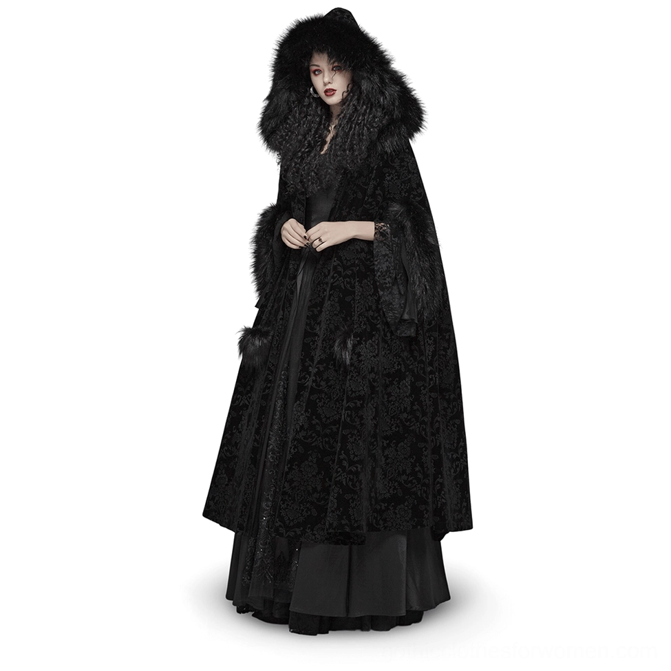 Black velvet Gothic hooded full-length cloak with faux fur trims and pom-pom closure, front view on model
