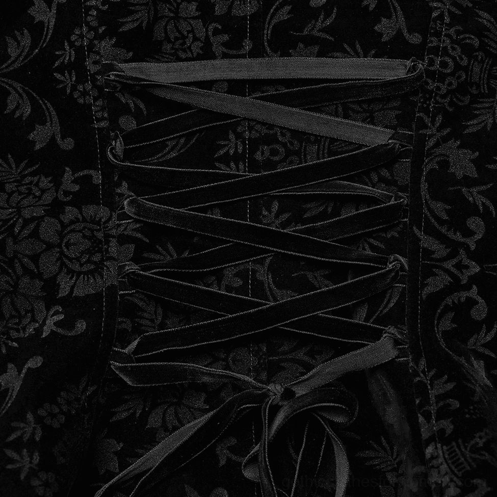 Black velvet corset lace-up back closure detail macro view showing ribbon lacing and floral jacquard pattern