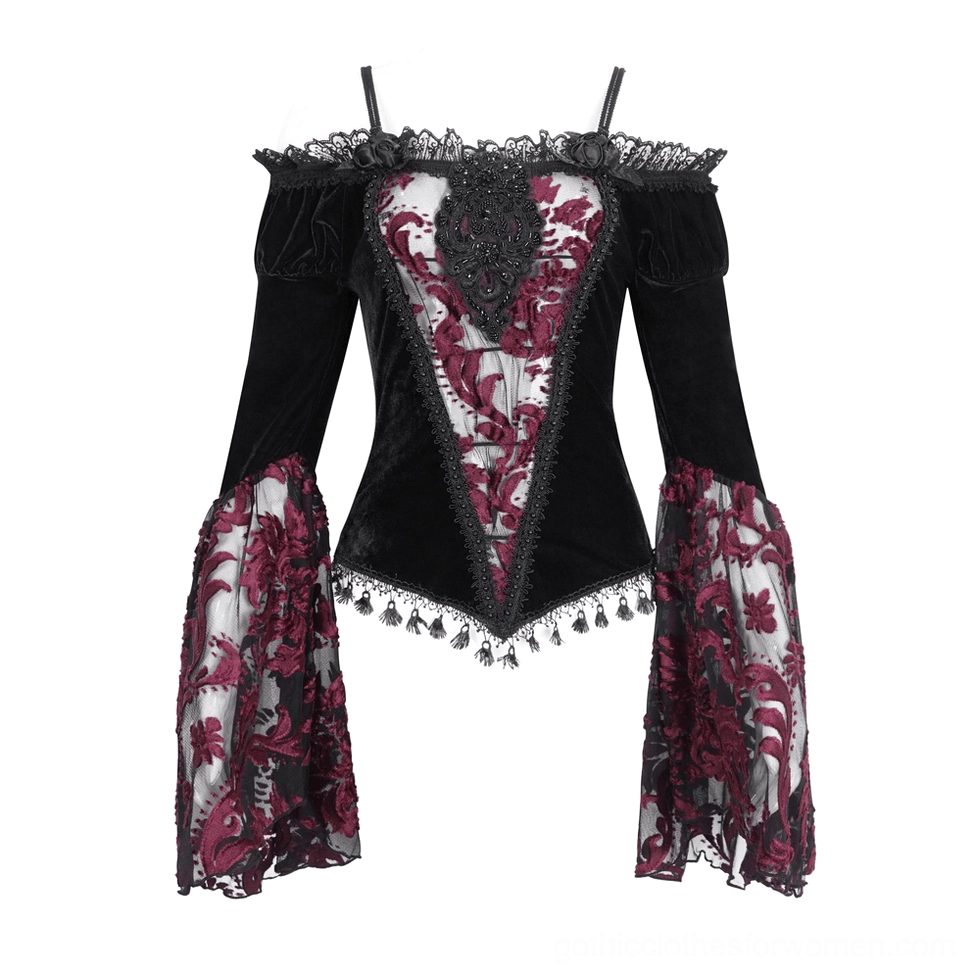Flat lay display of black velvet gothic top with burgundy mesh embroidery and tassel trim