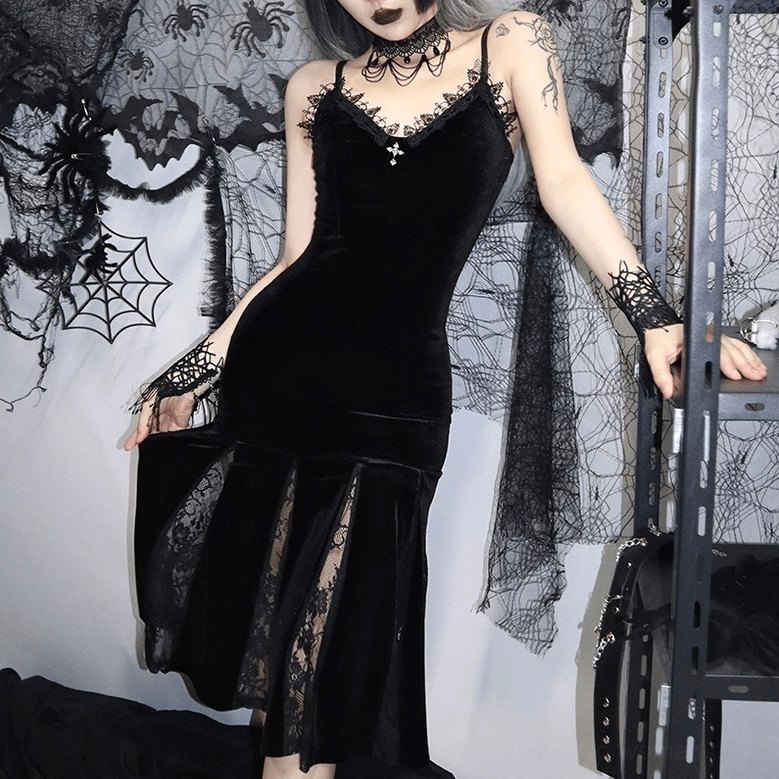 Black velvet gothic slip dress showing adjustable straps and form-fitting silhouette