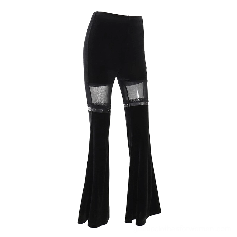 Side profile flat lay of black velvet flare pants highlighting mesh upper thigh inserts and flared leg silhouette