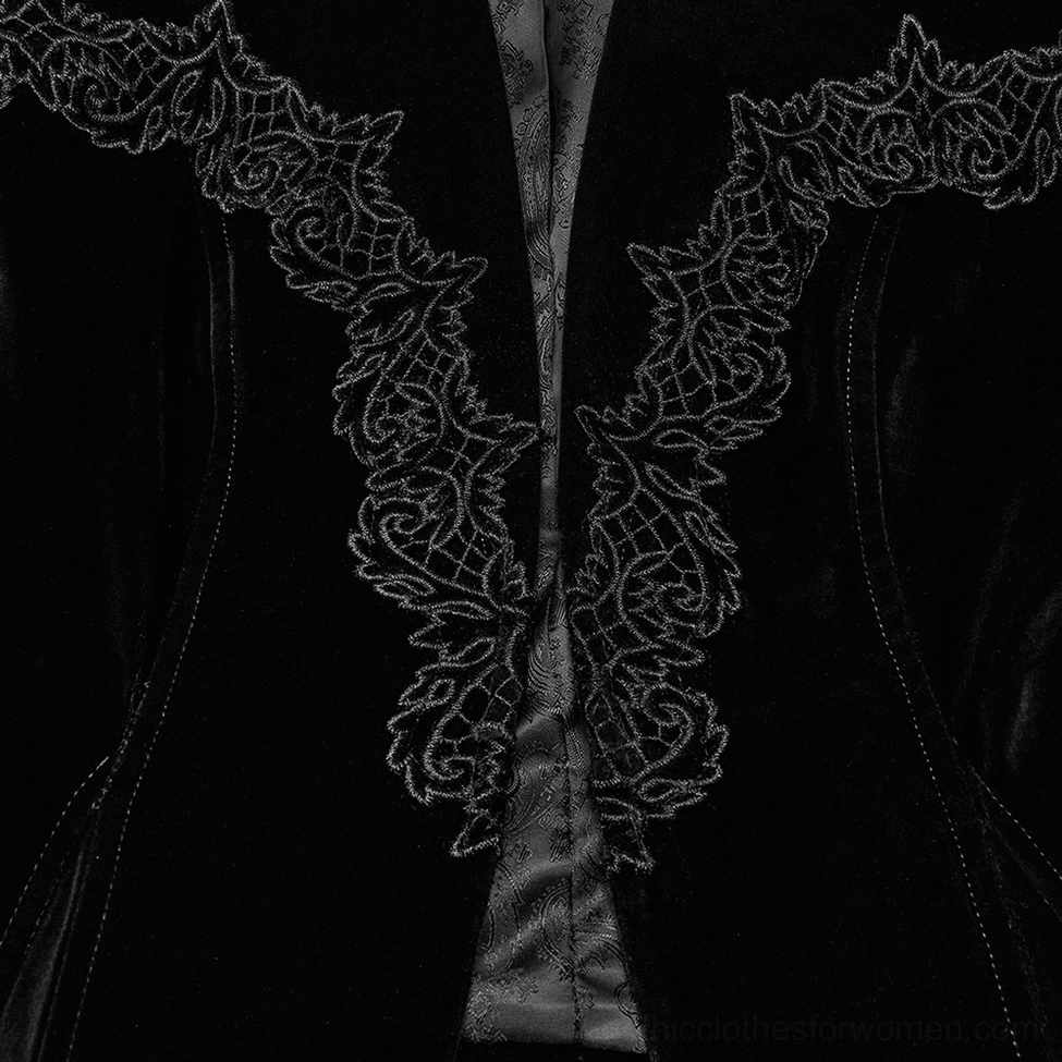 Close-up of black velvet gothic jacket collar showing intricate embroidered lace pattern