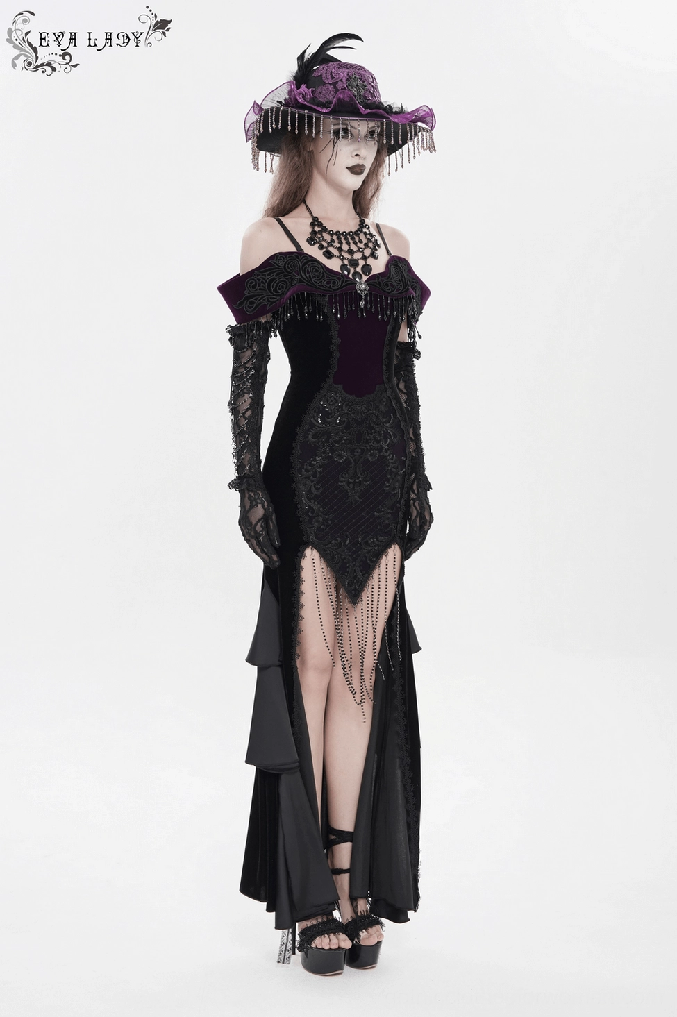 Black velvet off-shoulder dress three-quarter view showing overall silhouette and design