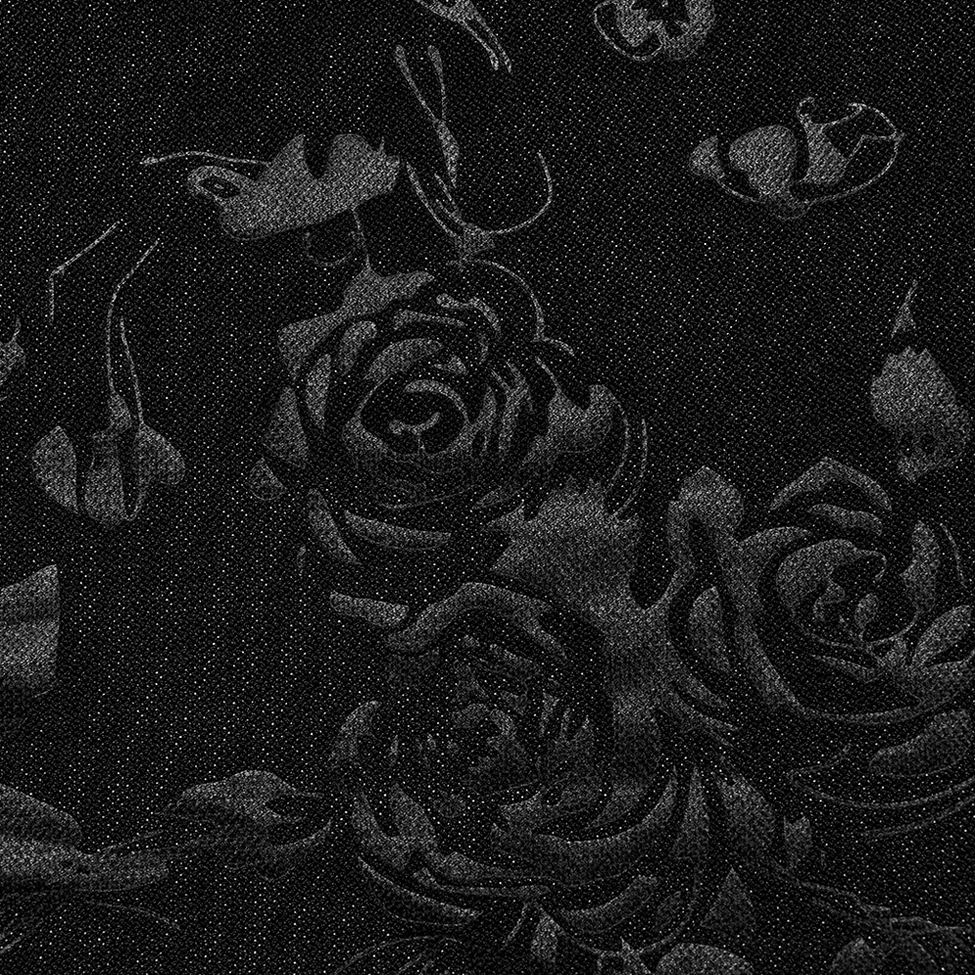 Black rose floral jacquard velvet fabric close-up detail showing embossed gothic pattern and luxurious texture