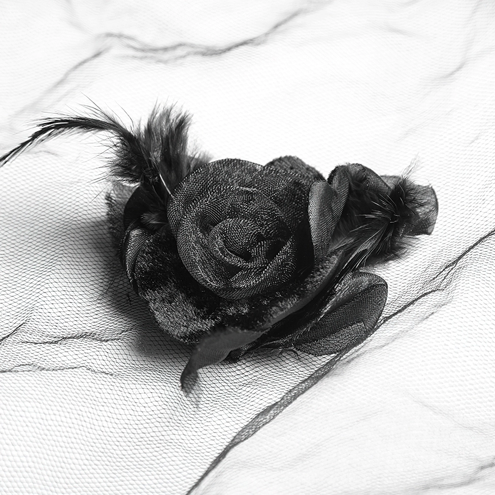 Single velvet black rose veil accessory with feather trim and tulle attachment shown in side view