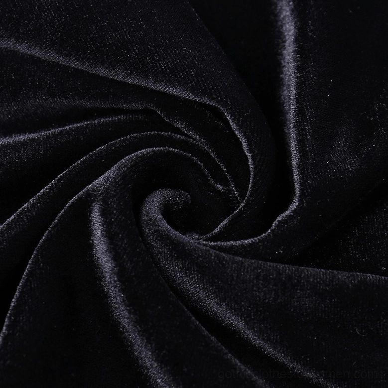 Black velvet slip dress showcasing mermaid silhouette and lace panel construction