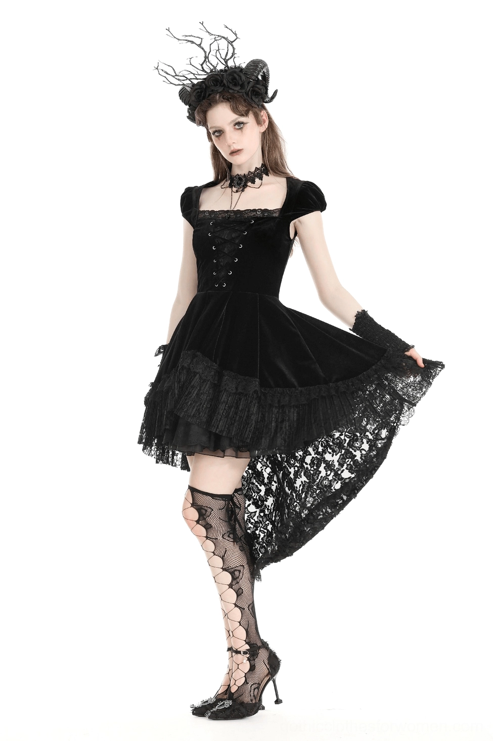 Full-length back view of black velvet swallowtail gothic dress showcasing dramatic tail silhouette, lace-up corset detailing, and overall architectural design from behind
