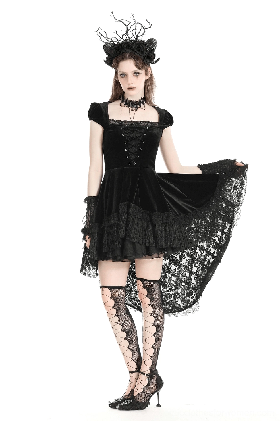 Three-quarter view of black velvet swallowtail gothic dress on mannequin showing overall silhouette with fitted bodice, cap sleeves, and flowing ruffled tail hem