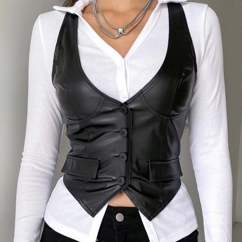 Black PU leather cropped waistcoat styled with white long-sleeve top and layered necklaces