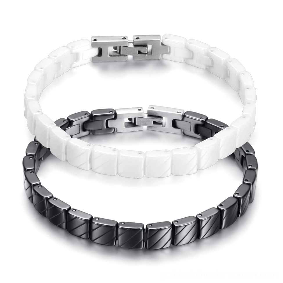 Black and white ceramic bracelets stacked together showing monochrome gothic color contrast