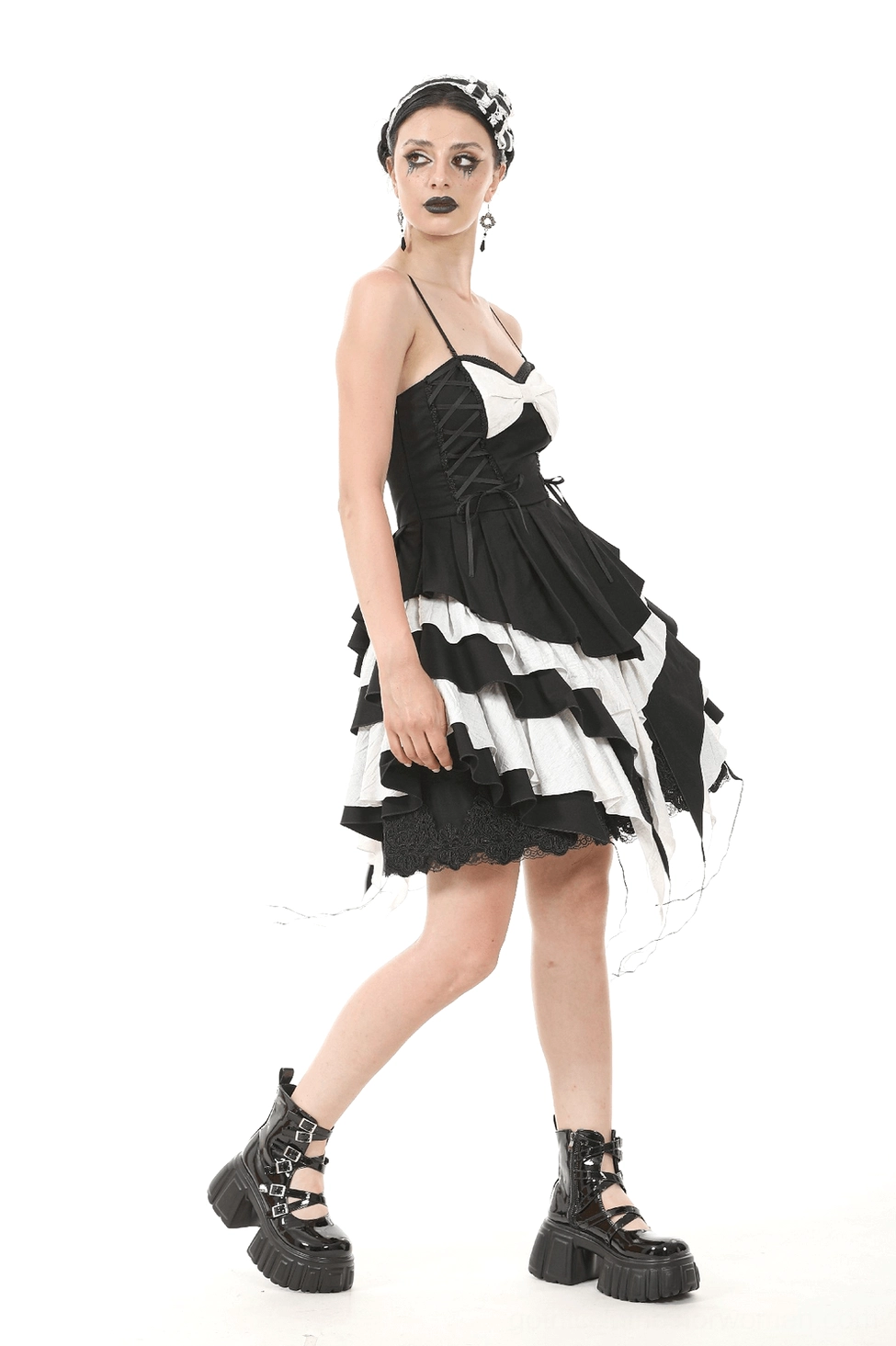 Full model shot black and white gothic ruffled dress with tassel hem and alternative fashion styling