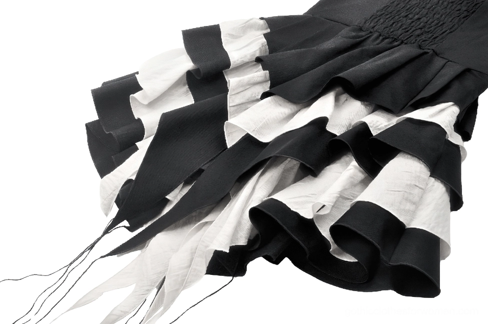 Full length side angle black and white tiered ruffle gothic dress with bow detail on model