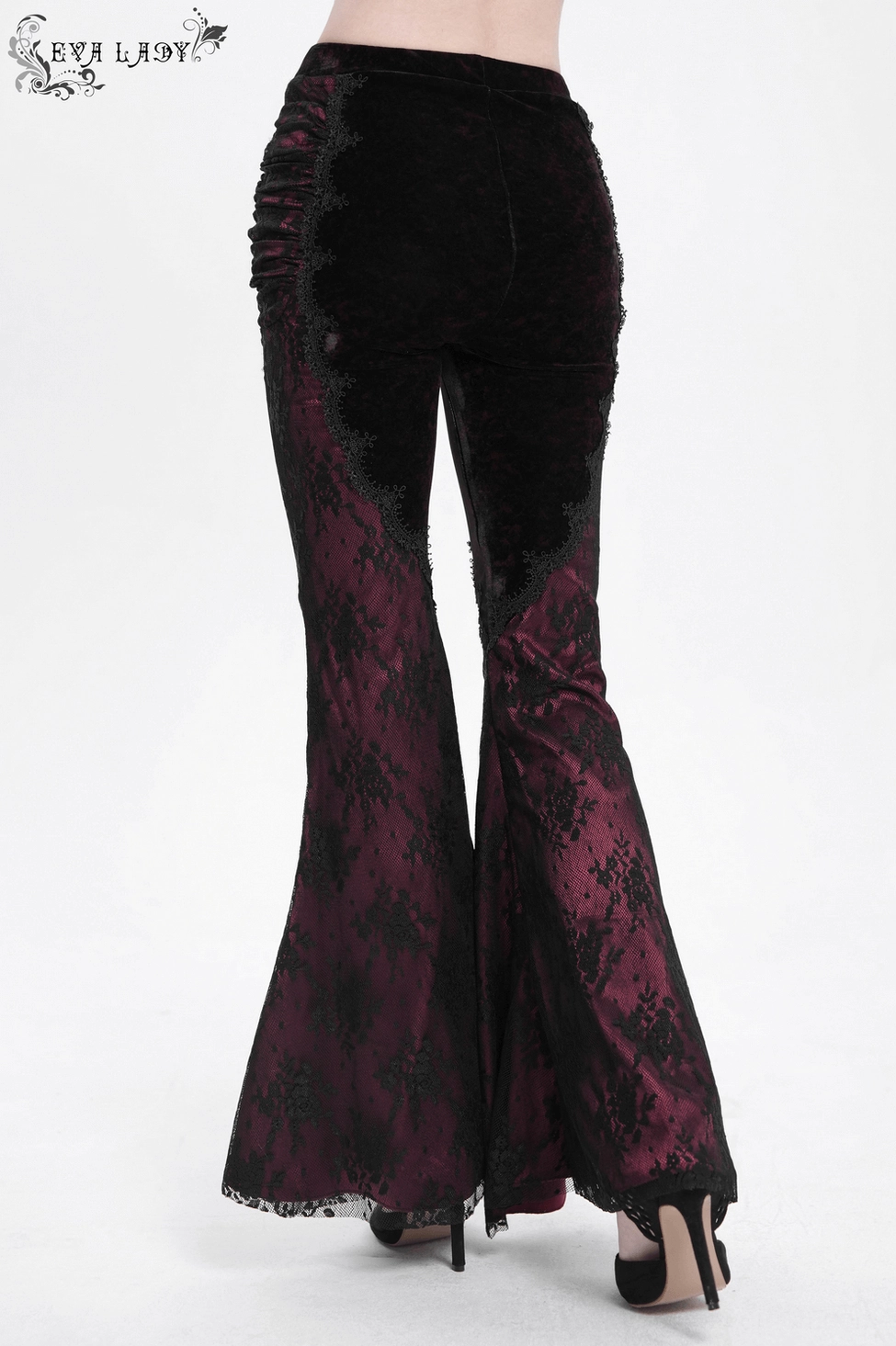 Black velvet gothic flare pants with wine-red lace construction showing theatrical drama of two-tone colorway and lace detailing