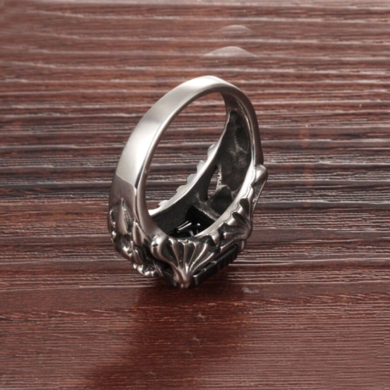 Black zircon gothic ring underside and side-back view showing carved metal frame, polished 316L stainless steel band, tension setting craftsmanship