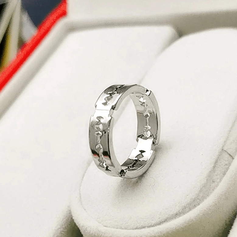 Silver gothic blade ring side profile showing smooth metal surface and blade styling design, displayed in jewelry storage box