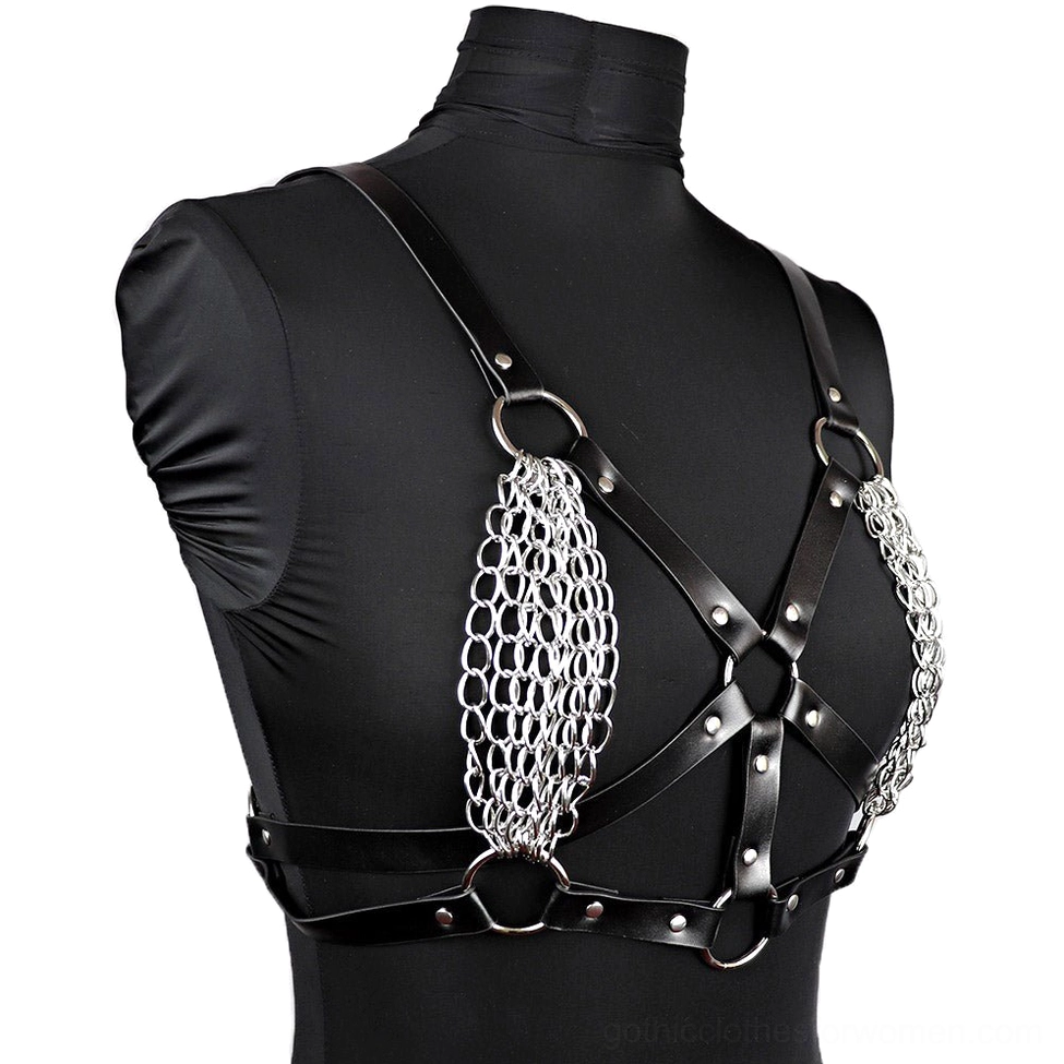 Left three-quarter angle of leather body harness displaying slim straps, silver chain decorations, and metal ring hardware details