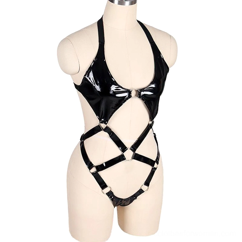 Black patent leather body harness on mannequin displaying front metal ring hardware and open strappy structure